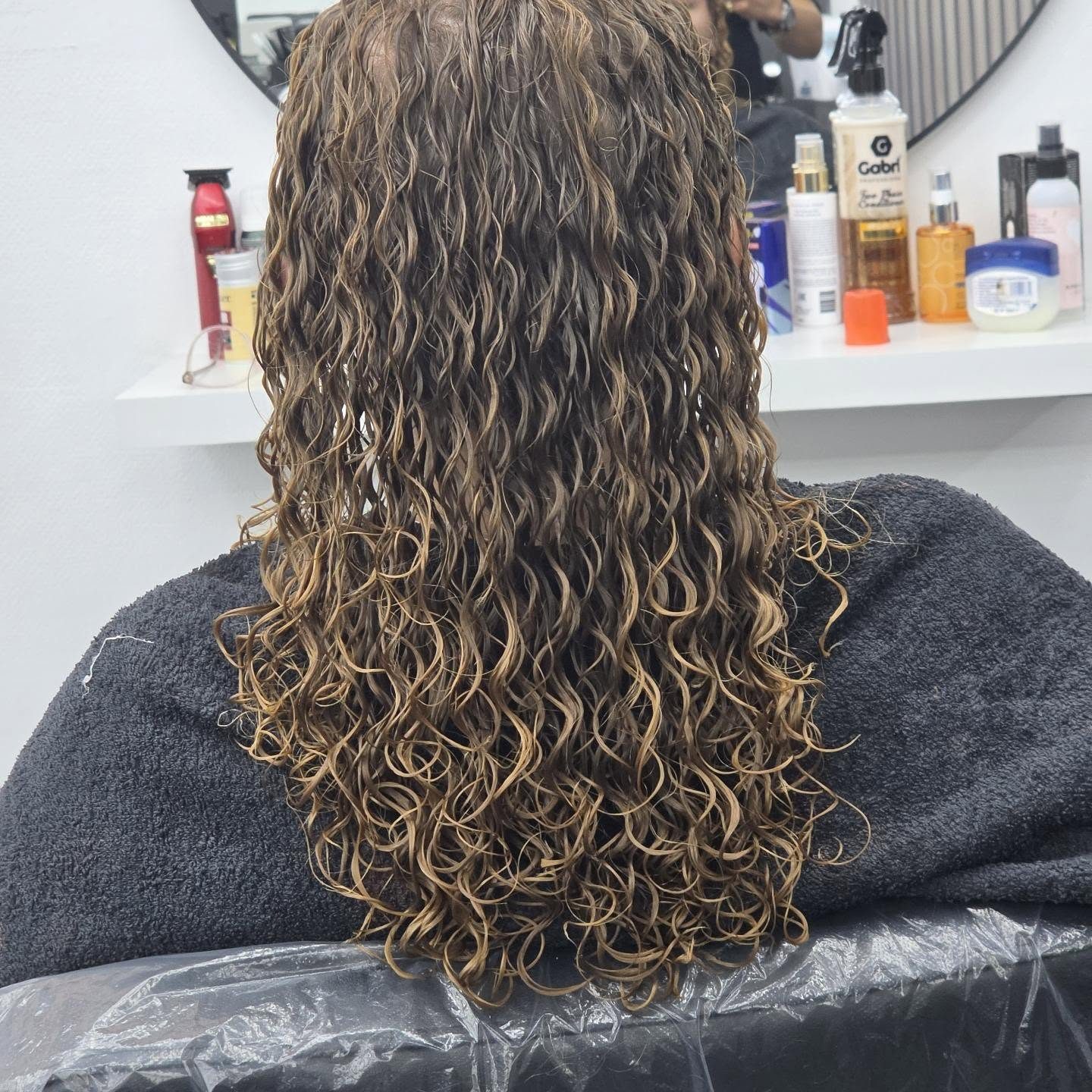 Lange krullen met balayage, achterkant